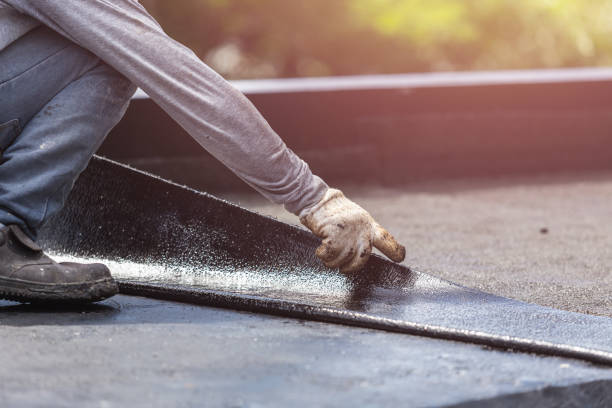 Professional Basement Waterproofing technician working in Elkhart Lake, WI